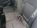 the back seats of a car with a seat belt in the back
