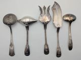 five spoons and two spoon spoons on a table