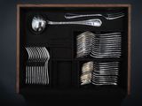 a wooden box filled with silverware and spoons