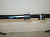 a close up of a bike handle with a blue logo on it
