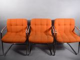 set of four orange upholstered chairs with chrome legs