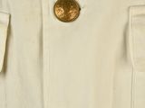 a close up of a white jacket with gold buttons