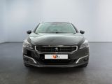 the front view of a black car in a white room