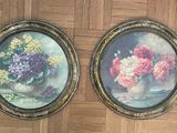 two paintings of flowers in a vase on the floor