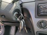 a car dashboard with a bunch of keys in it
