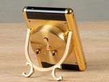 a cell phone that is sitting on top of a wooden table