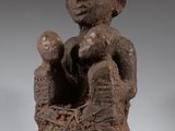an image of a statue of a woman holding a baby