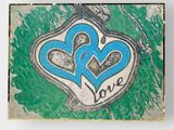 a picture of a painting of two hearts on the ground