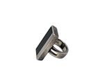 a close up of a silver ring with a black stone on it