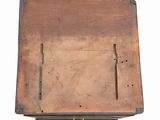 an old wooden box with a metal latch on it