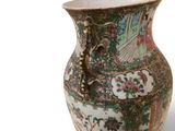 a vase that is sitting on a white surface