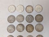 a lot of coins that are on the table