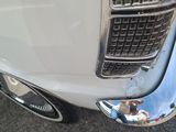 a close up of a car ' s grille with a reflection on it