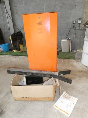 a box with a laptop inside of it on the floor