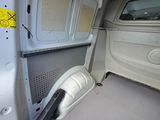 an image of the inside of a van with the door open