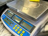 a scale that is sitting on a table in a kitchen