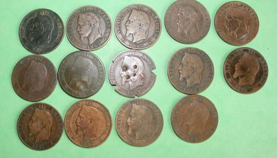 a close up of a bunch of coins on a green surface