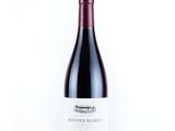 a bottle of red wine on a white background