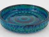 bol en céramique bleu et vert orné d'un motif circulaire