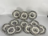 six black and white plates with white designs on them on a white surface