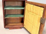 a small wooden box with a shelf inside of it