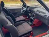 the interior of a car with two seats and a steering wheel