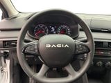 the steering wheel and dashboard of a car with a dash light on