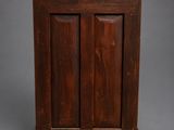 an old wooden cabinet with two doors and one door open