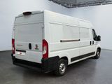 a white van that is parked in a room