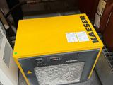 a yellow box sitting on the floor next to a brown box