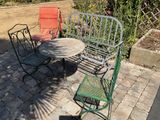 a table and chairs sitting on a brick patio