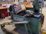 a man working on a machine in a workshop