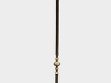 a lamp that is on a stand with a lamp shade on it