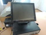 a small monitor sitting on top of a table