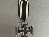 a close up of a medal with a black and white ribbon