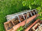 a pile of wood that is sitting in the grass