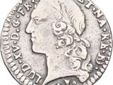 une pièce d'argent portant une tête de femme