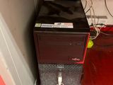 a computer that is sitting on top of a stand