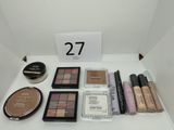 a lot of makeup and makeup products on the table