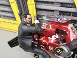 a figurine of a man sitting on a motorcycle
