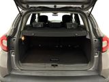 the back end of a car with the trunk open and the seats down