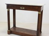 an image of a wooden table with a marble top on a white floor