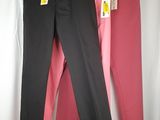 three pairs of pink and black pants hanging on a white curtain