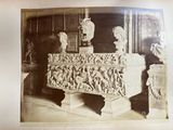 a picture of an old photo of a museum with statues
