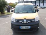 a small black and yellow van parked in a parking lot
