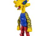 the simpsons figurine is standing on a base with a skateboard in his hand