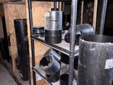 a metal shelf with many pots and pans on it