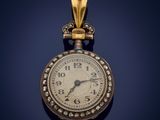a gold clock hanging from a chain on a blue background