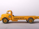 a toy truck that is sitting on a white surface