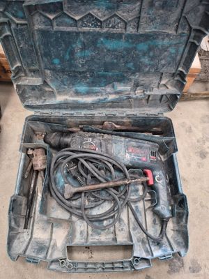 a tool box with tools inside of it on the ground